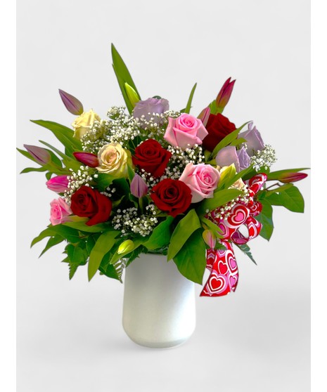 Let two lips meet this Valentine's after gifting this best-selling arrangement full of red and pink roses and tulips!