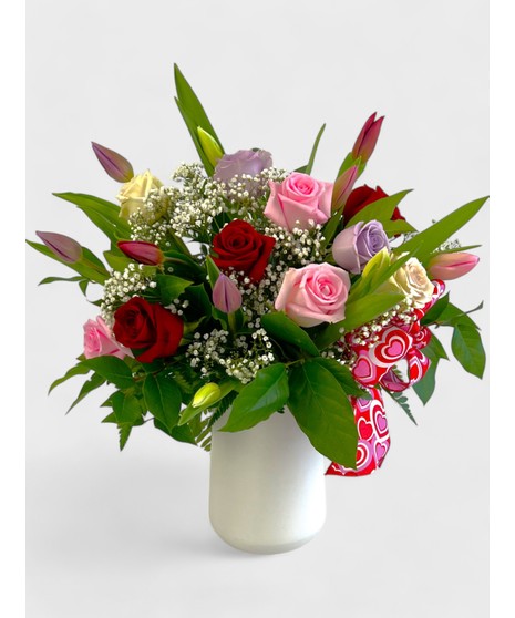 Let two lips meet this Valentine's after gifting this best-selling arrangement full of red and pink roses and tulips!